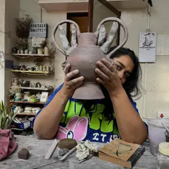 Here I am, peeking out from behind a new piece in the studio. This is my happy place, surrounded by mitti, works-in-progress, and endless possibilities. Every piece I make holds a little bit of this joy.
