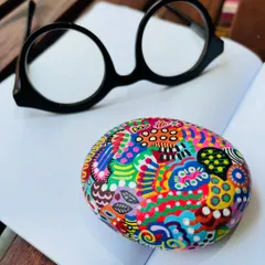 My hand-painted paperweight, styled on a notebook. Every swirl and dot is intuitive, just pure flow and feeling. It’s a small piece of art that works for you.