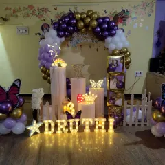 Another take on the popular butterfly theme, this time with a rich purple and gold balloon arch. I incorporated illuminated letters, a star, and a crown to add more sparkle to the birthday girl's special day.