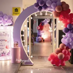 A lighted arch and personalized welcome sign for a butterfly party, creating a beautiful photo opportunity right at the entrance.