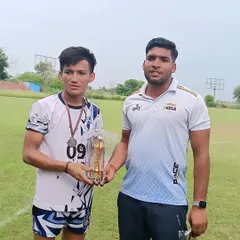 A player with his 'Guru ji'. The bond between coach and student is built on respect, trust, and shared goals.
