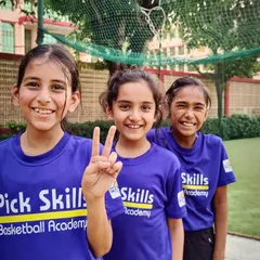 Three of our players sharing a smile. We believe basketball is more than a sport; it's a way of life that brings joy, builds skills, and creates lifelong memories.