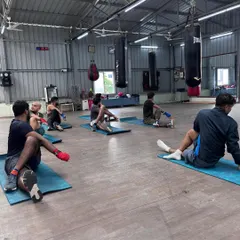 A seated spinal twist is another key part of our cool-down. This stretch helps improve mobility in the spine and hips, which is crucial for generating rotational power in your punches.