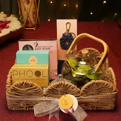 This is more than a gift, it's an experience. My curated festive hamper combines a living terrarium with other artisanal treats, all beautifully arranged in a rustic wicker basket for a truly memorable present.