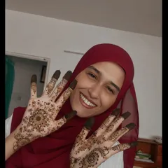 A happy client showing off her fresh, dark henna with a big smile. It's always a pleasure to adorn her hands and see how much she loves the final result.