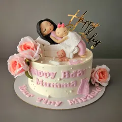 Capturing so many emotions on one lil cake. This chocolate and salted caramel cake for a new mom's birthday features a touching figurine of a mother cuddling her newborn.