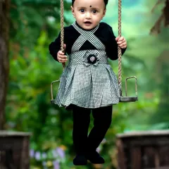 The simple joy of a swing ride. This photo is from a fun and candid toddler photoshoot, where the focus is on capturing genuine expressions and playful moments.