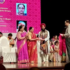 On stage, receiving the fellowship award at the Shanmukhananda Auditorium in Mumbai. It is a prestigious award for young and promising musicians.