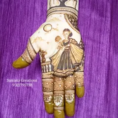 The full Karwachauth design after the henna paste has been applied, showing the rich detail and shading.