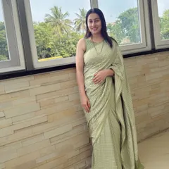 Dr. Shruthi redefines modern grace in our pastel green Banarasi silk, a soft statement of power and poise.