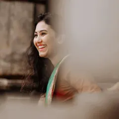 A candid shot capturing a moment of pure, uninhibited laughter. This photo, with its soft focus and natural feel, shows my love for capturing authentic expressions that reveal a person's true spirit.