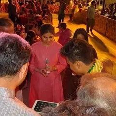 The best magic happens when everyone gathers around. In this moment, a group of guests watches intently as an illusion unfolds on my iPad. This type of strolling magic ensures that everyone at your event gets a front row seat to the action.