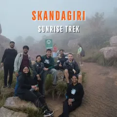 A promotional graphic for our Skandagiri Sunrise Trek. We handle all the logistics so you can focus on the view.