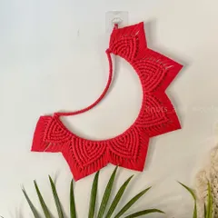Inspired by the Strawberry Moon, this red crescent moon hanging is a reminder to appreciate how far you've come. It's a unique piece of fiber art that adds a pop of color and a meaningful touch to your space.