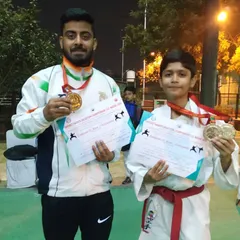 Two more gold medalists from the district championship. We focus on developing talent across all age groups, from young juniors to senior competitors.