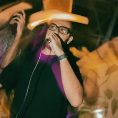 A close-up shot of me on the mic, fully locked in. Whether I'm DJing or MCing, my focus is always on controlling the sound and keeping the energy levels up.