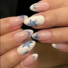 This elegant nail set features delicate, watercolor-style floral art. We teach our students the brush techniques required to create soft, blended designs that are popular in modern nail artistry.