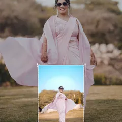 A stylish portrait of the bride in her pastel pink Haldi saree, her carefree spirit captured as the fabric flows in the wind.