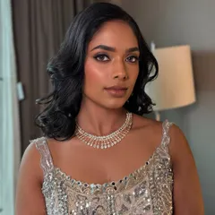 For this gorgeous reception bride, I wanted to create a true "goddess glow". I focused on a flawless, luminous base to celebrate her beautiful dusky skin tone, paired with a sultry brown smokey eye and a nude lip for a look that is pure glamour.
