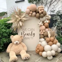 I love the simplicity and warmth of a boho baby shower. This 'We Can Bearly Wait' theme uses a neutral palette, an organic balloon garland, pampas grass, and a giant teddy bear for a chic and modern celebration.