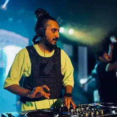 A duplicate of image 58, showing my concentration while mixing at the large-scale auto expo event in Kerala.