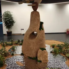 Art can be a powerful way to express a brand's values. This nature-inspired rock installation was created for a construction group to embody their commitment to eco-friendly practices, resilience, and integrity, blending sustainable art with corporate identity.