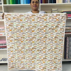 The reverse side of the beginner's quilt, featuring a playful car-themed fabric, perfect for a child's gift.
