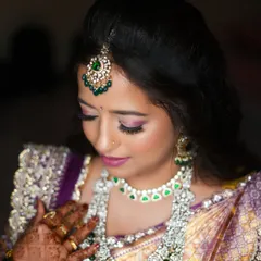 A classic bridal portrait capturing the elegance of the bride and her exquisite jewelry.