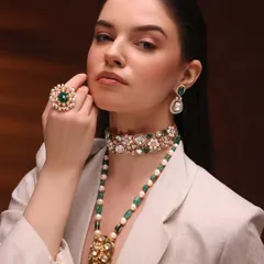For this high-fashion jewelry shoot, the makeup had to be elegant and strong without overpowering the stunning emeralds. I created a sculpted, earthy look with a matte lip and defined eyes to complement the modern-meets-traditional styling.