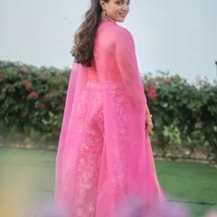 A full-length view showcasing how the soft, natural makeup complements the entire ensemble for an effortlessly elegant mehendi look.