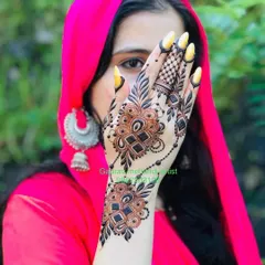This stylish back-hand design features a modern take on a traditional jewelry pattern, known as a "hathphool." The bold geometric shapes and delicate chains create a striking look.