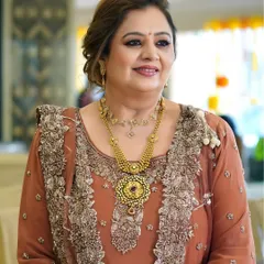 A glowing look for the mother of the groom for the dhol party. The makeup is warm and celebratory, with a focus on enhancing her natural features to match the festive occasion.