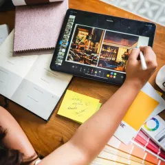 The tools of my trade. My desk is a mix of digital and analog, from an iPad for sketching and mood boards to physical planners and swatch books. This blend allows me to stay organized while keeping the creative process tactile and personal.
