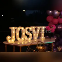 Make your child's name shine with custom marquee letters. These large, illuminated letters add a personalized and glamorous touch to the decor, perfect for birthday parties and naming ceremonies.