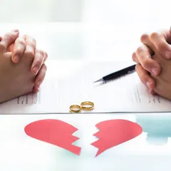 Two people sitting across a table with a broken heart signifies the difficult decision to separate. I provide expert legal advice to help you navigate this challenging time with clarity and confidence.