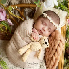 Snuggled up with a tiny teddy bear friend. I have a collection of handmade props like this to add a touch of sweetness to your baby's portraits.