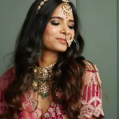 A close-up of the complete traditional bridal look, including the nath (nose ring). Every detail is crafted to perfection for her special day.
