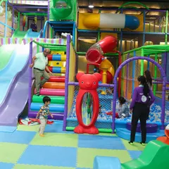 Our multi-level play structure offers endless opportunities for climbing, exploring, and adventure. Even adults can't resist joining in on the fun sometimes.