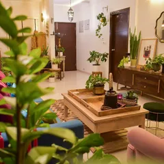Another angle of my plant-filled living room. I use plants of different heights and textures to create a mini indoor jungle.