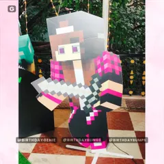 A close-up of a life-sized Alex character cutout from Minecraft, showing the detailed, pixel-perfect design.