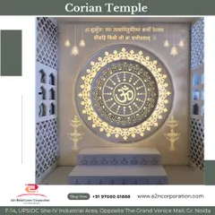 A grand Corian temple design featuring a large, circular backlit panel with the "Om" symbol and Gayatri Mantra. The design is framed by jali-cut side panels and includes tiered steps for placing idols, creating a complete and divine prayer hall.