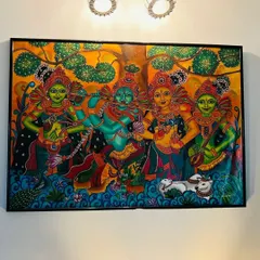 A closer look at the painting in its new home, with the wall lights highlighting its vibrant colors.