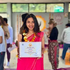 Proudly holding my certification. This training wasn't just about asanas; it was a deep dive into the sutras, mantras, and meditation that I now share with you during our retreats to foster inner clarity.