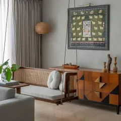 Blending contemporary design with traditional Indian elements is our specialty. For 'House Nandini', we incorporated a beautiful teak wood and rattan swing, a special request from the client, to create a relaxing corner that connects the home to its cultural roots while maintaining a modern aesthetic.