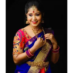 A full view of a South Indian bridal look created for a model shoot. The makeup features bright pink eyeshadow and a matching lip, coordinated perfectly with the colorful silk saree and temple jewelry.