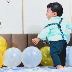 The simple joy of a toddler playing with balloons. My candid photography style aims to capture your child's personality as they explore and have fun.