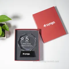 We celebrate milestones with elegance and precision. This custom-designed crystal trophy for Zynga commemorates a 5-year work anniversary, featuring their logo etched on the base and presented in a branded protective box.