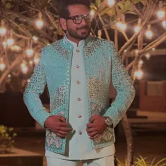 Dressed for a sundowner wedding in a beautiful pastel blue jacket with heavy sequin work. It’s a modern, glamorous take on ethnic wear.