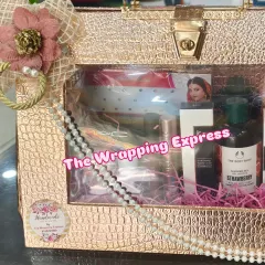 For wedding trousseau packing, I focus on elegance and practicality. This stylish rose gold case is filled with premium makeup and skincare products, making it a perfect and useful gift for the bride.