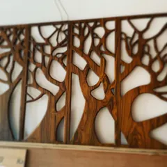 This work-in-progress shot shows a custom CNC-cut wooden wall mural with a tree motif. This type of detailed woodwork can be used to create a stunning feature wall in an office or home.